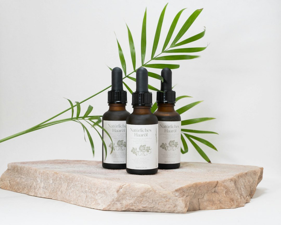 Natural botanical hair oil bottle with herbs