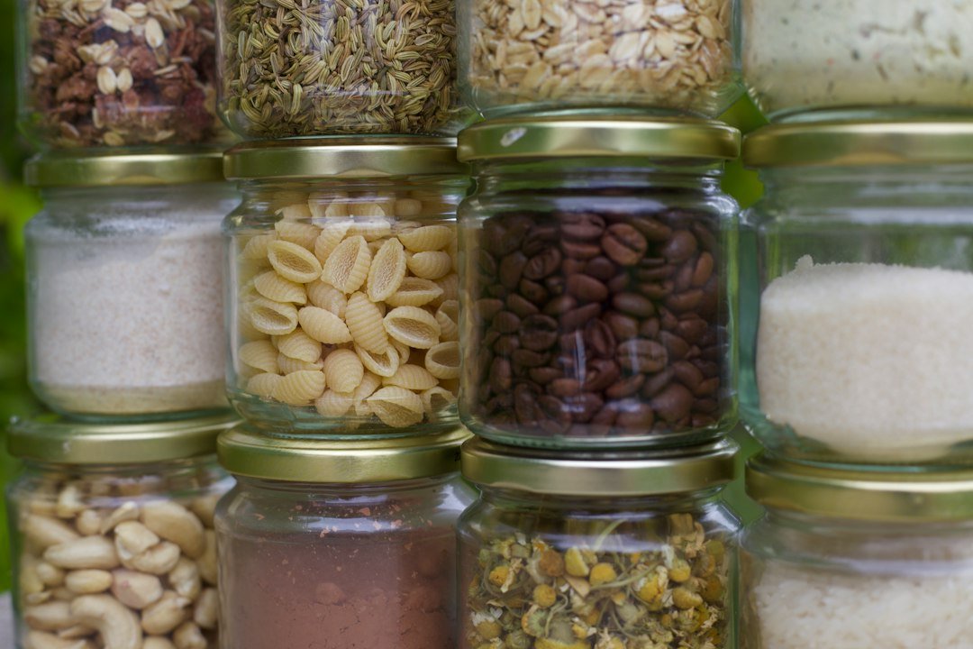 Dry grains seeds and food ingredients in glass containers