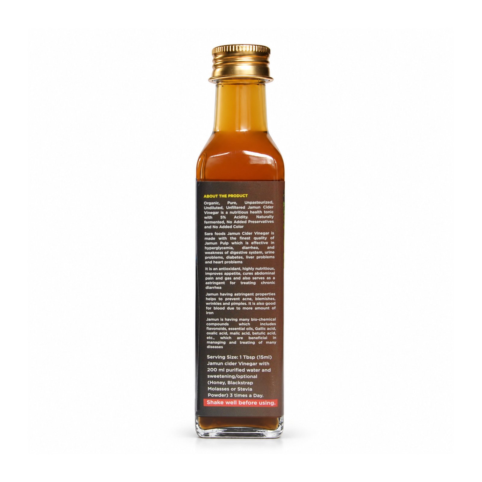 Original Jamun Cider Vinegar glass bottle with gold cap and maroon back label on a white studio background